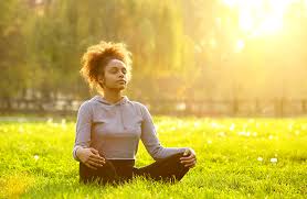 girl meditating outside
